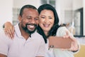 Senior black couple, selfie and smile in home together for hug, social media or relax for memory for love. Mature man Royalty Free Stock Photo