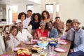 Senior African American  couples sitting at dinner table celebrating at home with family,selective focus Royalty Free Stock Photo