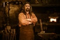 Senior blacksmith in smithy