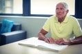Senior blind man reading a braille book Royalty Free Stock Photo