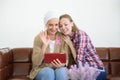 Senior breast cancer patient and her daughter use tablet to conversation by webcam, cancer concept