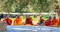 Senior Buddhist monks sitting infront of Maya Devi Temple at Lumbini, Nepal