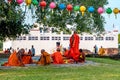 Senior Buddhist monks sitting infront of Maya Devi Temple at Lumbini, Nepal