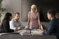 Senior business group leader woman standing at meeting table Royalty Free Stock Photo