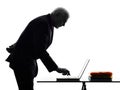 Senior business man computing typing silhouette Royalty Free Stock Photo