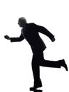 Senior business man running silhouette Royalty Free Stock Photo