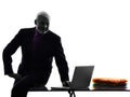 Senior business man silhouette computing