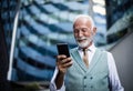 Senior business man using smart phone Royalty Free Stock Photo