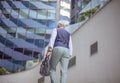 Senior business man walking trough street New day for work Royalty Free Stock Photo