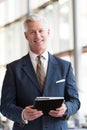 Senior business man working on tablet computer Royalty Free Stock Photo