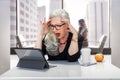 Older business woman panicked and having an anxiety attack, stressed at work office on computer for possible retirement, finances, Royalty Free Stock Photo