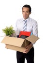 senior businessman carrying office box fired from work sad desperate depressed after loosing job