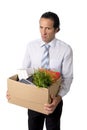 senior businessman carrying office box fired from work sad despe