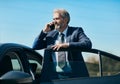 senior businessman cell phone mobile luxury car manager vehicle Royalty Free Stock Photo