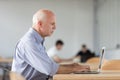 Senior businessman concentrating on his work Royalty Free Stock Photo