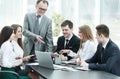 Senior businessman discussing with business team to work issues Royalty Free Stock Photo