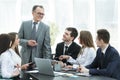 Senior businessman discussing with business team to work issues Royalty Free Stock Photo