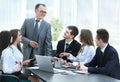 Senior businessman discussing with business team to work issues Royalty Free Stock Photo