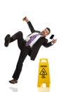 Senior Businessman Falling on Wet Floor Royalty Free Stock Photo