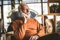 Senior businessman at his home talking phone. Royalty Free Stock Photo