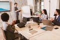 Businessman leading meeting at boardroom table Royalty Free Stock Photo