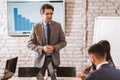 Businessman leading meeting at boardroom table Royalty Free Stock Photo