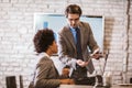 Businessman leading meeting at boardroom table Royalty Free Stock Photo