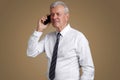 Senior businessman with mobile phone Royalty Free Stock Photo