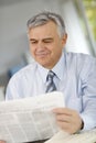 Senior businessman reading news Royalty Free Stock Photo