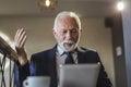 Senior businessman reading news on tablet computer Royalty Free Stock Photo