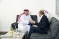 Senior Businessman Shaking hands with Arabian Businessman Royalty Free Stock Photo