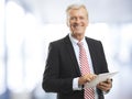 Senior businessman with tablet Royalty Free Stock Photo