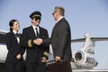 Senior Businessman Thanking Airplane Captain