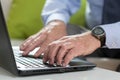 Senior businessman uses laptop for work Royalty Free Stock Photo