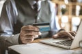 Senior businessman using laptop to check credit card . Royalty Free Stock Photo