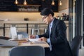 senior Businessman working at coffee shop