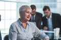 senior businesswoman sitting in front of a Desk Royalty Free Stock Photo