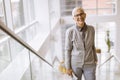 Senior businesswoman standing on the stairs in office Royalty Free Stock Photo