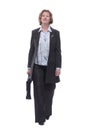 Senior businesswoman in suit walking towards carrying a briefcase Royalty Free Stock Photo