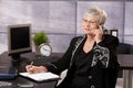 Senior businesswoman using cellphone