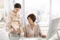 Senior businesswoman working with assistant