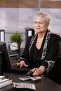 Senior businesswoman working in office Royalty Free Stock Photo