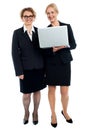 Senior businesswomen posing with laptop Royalty Free Stock Photo