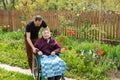 Senior care assistant with very old disabled woman in nursing home. Royalty Free Stock Photo