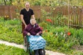 Senior care assistant with very old disabled woman in nursing home. Royalty Free Stock Photo