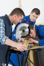Senior carpenter with two apprentices learning Royalty Free Stock Photo