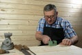 Senior carpenter working in his workshop