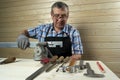 Senior carpenter working in his workshop