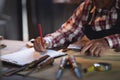 Senior carpenter working on woodworking machines in carpentry shop. man works in a carpentry shop. Royalty Free Stock Photo