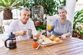 Senior caucasian couple smiling happy having breakfast at the terrace Royalty Free Stock Photo